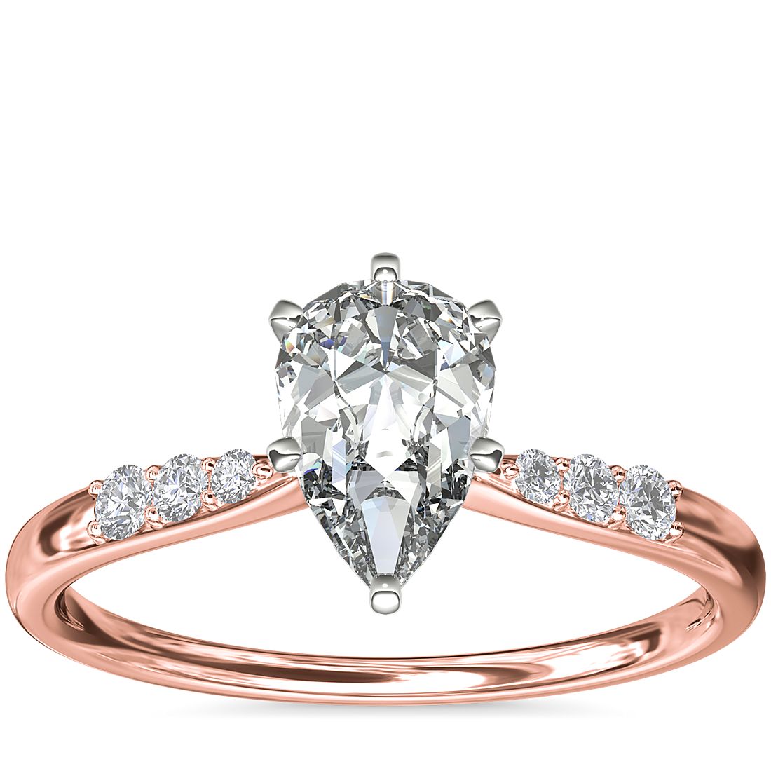 Anillo de compromiso de oro rosado con un diamante en forma de pera de 1 quilate.
